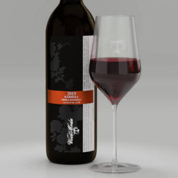 A pour of 2019 Barbera with label shown on bottle